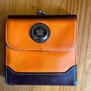 Dooney and Bourke 5 inch by 5 inch orange leather wallet/coin purse